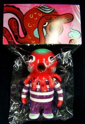 New Year Globby - Red & Clear Purple figure by Bwana Spoons, produced by Gargamel. Packaging.