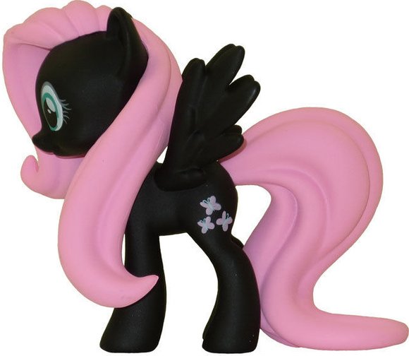 Fluttershy figure, produced by Funko. Side view.
