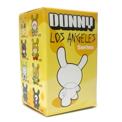 Gary Baseman Gold Dunny figure by Gary Baseman, produced by Kidrobot. Packaging.