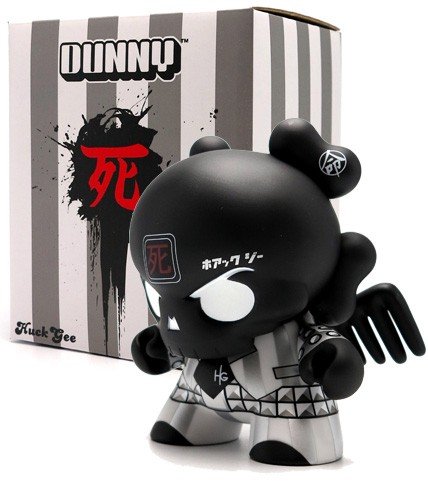 Black Skullhead 8” Dunny figure by Huck Gee, produced by Kidrobot. Packaging.