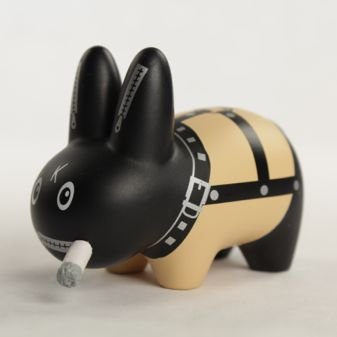 Bondage Smorkin Labbit Mini figure figure by Frank Kozik, produced by Kidrobot. Side view.