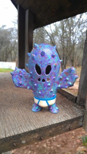 Cosmic Little Prick GID figure by Brandon Morrow, produced by Super7. Front view.