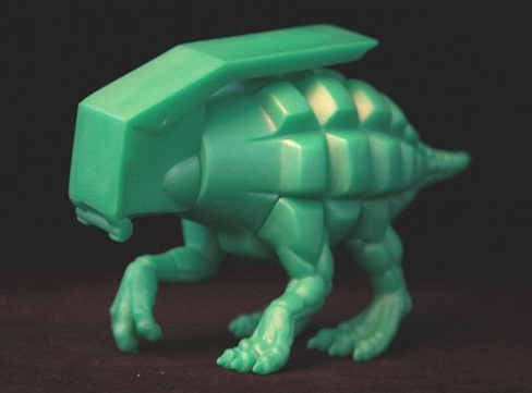 Dinogrenade figure by Ron English, produced by Popaganda. Side view.