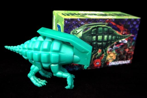 Dinogrenade figure by Ron English, produced by Popaganda. Packaging.