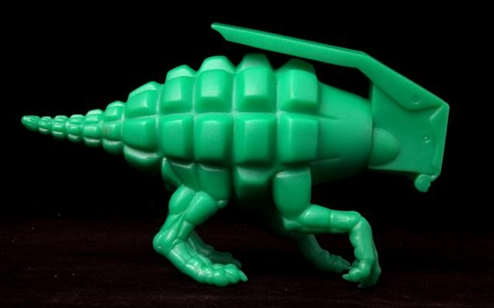 Dinogrenade figure by Ron English, produced by Popaganda. Side view.