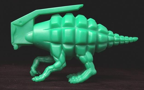 Dinogrenade figure by Ron English, produced by Popaganda. Side view.