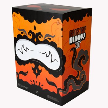 Dunny 20 Orange Drop figure by Andrew Bell, produced by Kidrobot. Packaging.