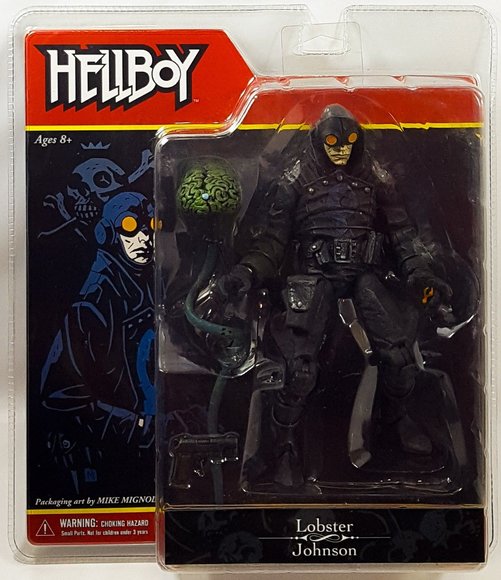 Lobster Johnson figure by Mike Mignola, produced by Mezco Toyz. Packaging.