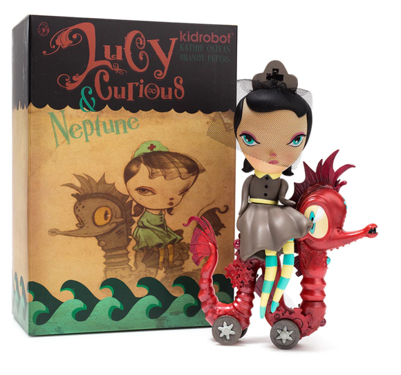 Lucy Curious & Neptune figure by Kathie Olivas & Brandt Peters, produced by Kidrobot. Packaging.