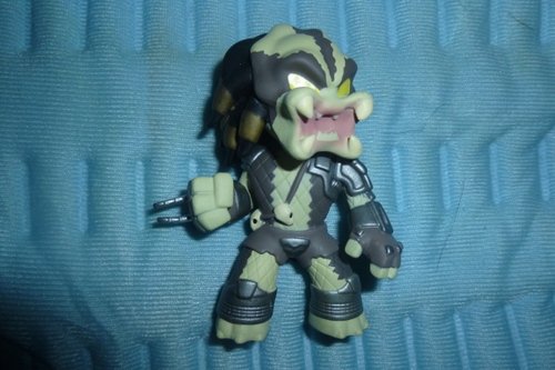 Predator figure, produced by Funko. Front view.