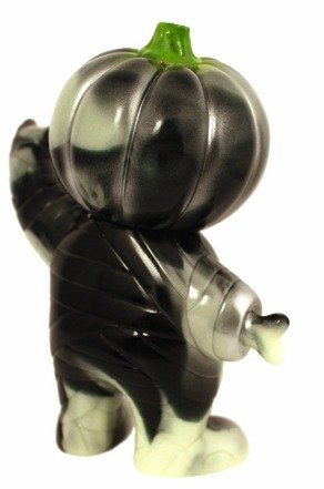 Pumpkin Boy - Black And Glow Swirl figure by Brian Flynn, produced by Super7. Back view.