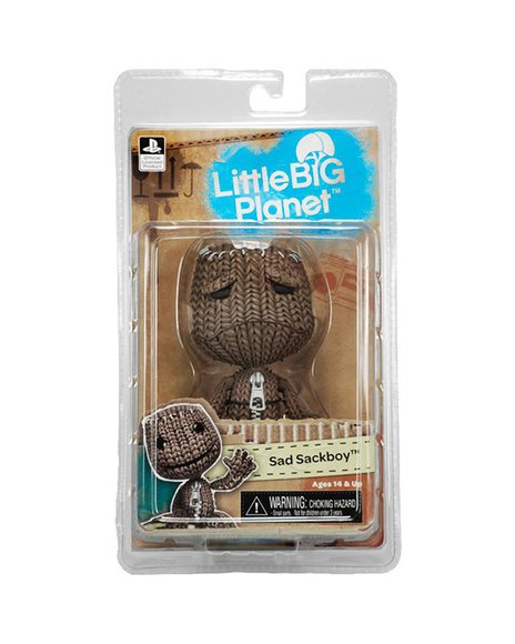 Sad Sackboy figure by Mark Healey And Dave Smith, produced by Neca. Packaging.