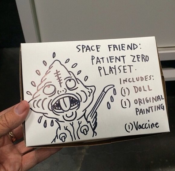 Space Friend figure by Mishka, produced by Suckadelic. Packaging.