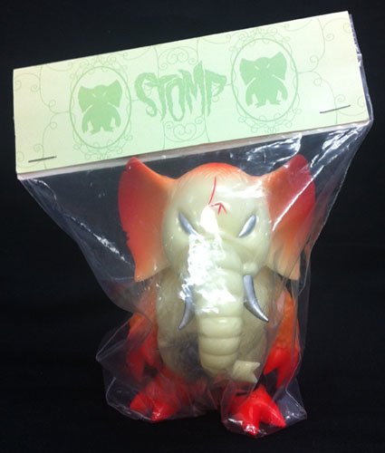 Stomp - SDCC 07 GID Orange  figure by Brian Flynn, produced by Super7. Packaging.