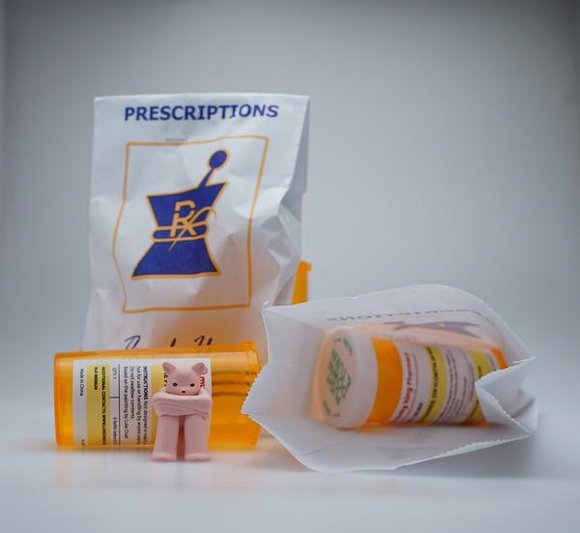 The Prisoner - Oxycontin figure by Luke Chueh, produced by Munky King. Packaging.