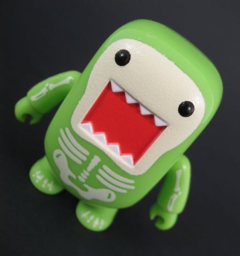 Radioactivity Skeleton GID Domo Qee figure by Dark Horse Comics, produced by Toy2R. Front view.
