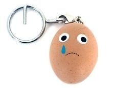 Sad Boiled Egg figure by Heidi Kenney, produced by Kidrobot. Front view.