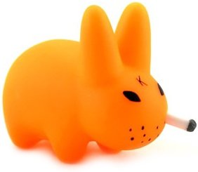 Smorkin Labbit - Fluorescent Orange figure by Frank Kozik, produced by Kidrobot. Front view.