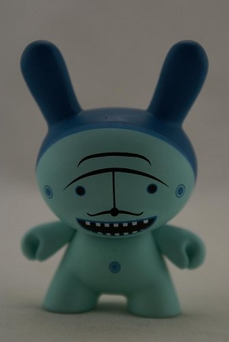 Moustache Blue figure by Dalek, produced by Kidrobot. Front view.