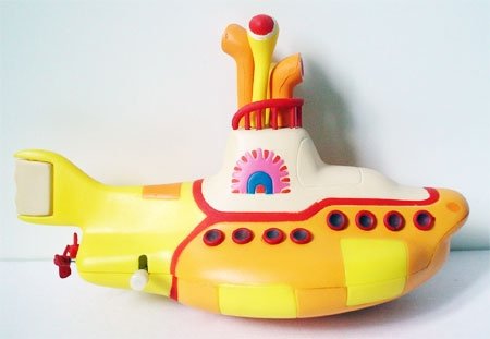 Yellow Submarine figure by Heinz Edelmann, produced by Mcfarlane Toys. Front view.
