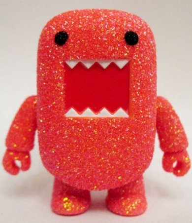 Orange Glitter Domo figure by Dark Horse Comics, produced by Toy2R. Front view.