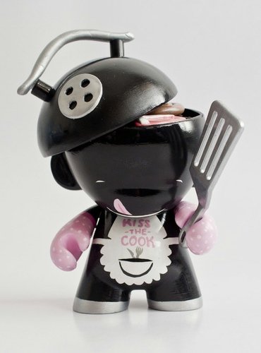 Kiss the cook figure by Emma Cook, produced by Kidrobot. Front view.