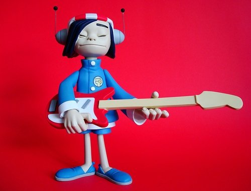 Noodle figure by Jamie Hewlett, produced by Kidrobot. Front view.