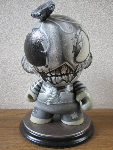 Pumpkin Boy figure by Brandt Peters, produced by Kidrobot. Front view.