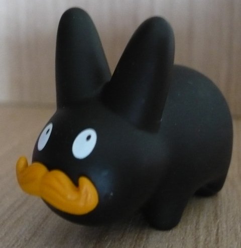 Happy Labbit figure by Frank Kozik, produced by Kidrobot. Front view.
