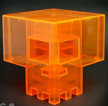 Clear Orange Sqube figure by Ferg, produced by Jamungo. Front view.