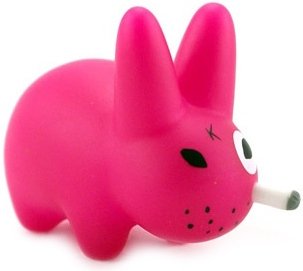 Smorkin Labbit - Florescent Pink figure by Frank Kozik, produced by Kidrobot. Front view.