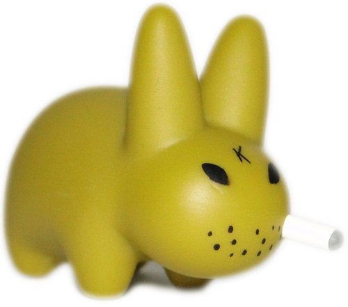 Mini Smorkin Labbit - Olive figure by Frank Kozik, produced by Kidrobot. Front view.