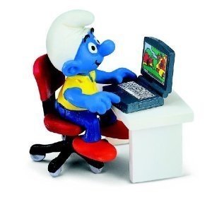 Super Smurf with Laptop figure, produced by Schleich . Front view.