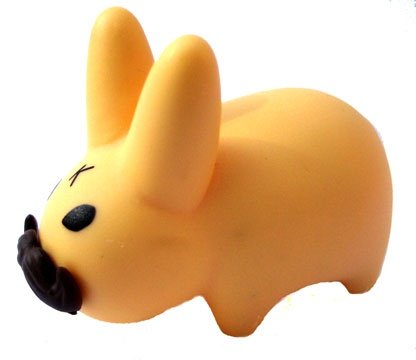 Mustache Labbit figure by Frank Kozik, produced by Kidrobot. Front view.