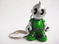 Green figure, produced by Kidrobot. Front view.