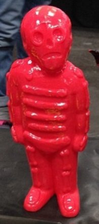 Bones - NYCC 13 - Untouched, Cherry Red figure by Mike Egan, produced by Grody Shogun. Front view.