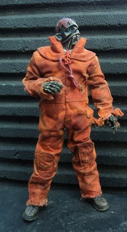 orange red og zomb figure by Ashley Wood, produced by Threea. Front view.