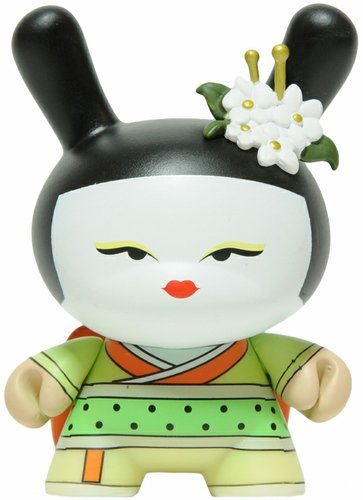 Yellow Geisha figure by Huck Gee, produced by Kidrobot. Front view.