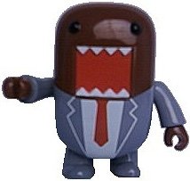 Gray Suit Domo figure by Dark Horse Comics, produced by Toy2R. Front view.