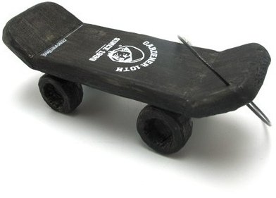 Kindergardener Skateboard Keychain - Black figure by Michael Lau, produced by Crazysmiles. Front view.