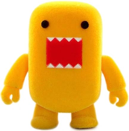 Yellow Flocked Domo Qee figure by Dark Horse Comics, produced by Toy2R. Front view.