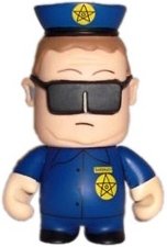 Officer Barbrady figure by Matt Stone & Trey Parker, produced by Kidrobot. Front view.