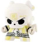 Skullhead Yellow Chase figure by Huck Gee, produced by Kidrobot. Front view.