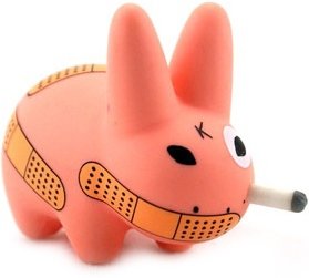 Smorkin Labbit - Band Aid figure by Frank Kozik, produced by Kidrobot. Front view.