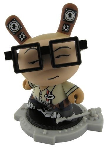 DJ Qbert - Tan figure by Huck Gee, produced by Kidrobot. Front view.