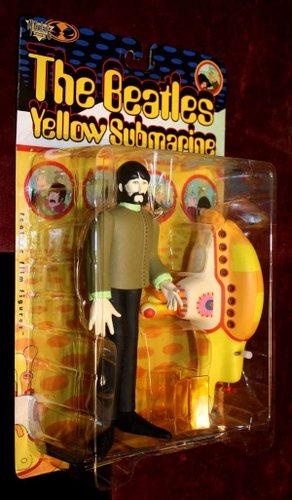 George Harrison with Yellow Submarine figure by Heinz Edelmann, produced by Mcfarlane Toys. Front view.