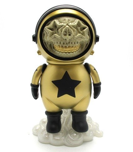 Dum English - Gold figure by Ron English X Chris Brown, produced by Made By Monsters. Front view.