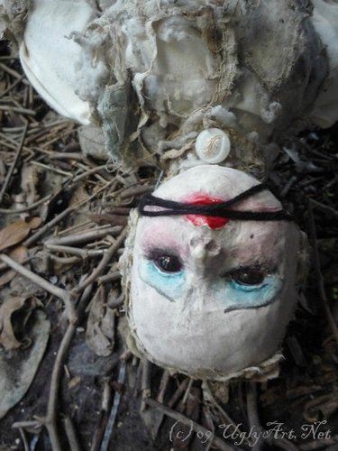 old blanket and a withered garden  figure by Ugly Shyla, produced by Uglyart.Net . Front view.