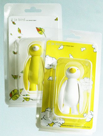 Yellow Ji Ja Bird figure by Mr. Clement. Packaging.